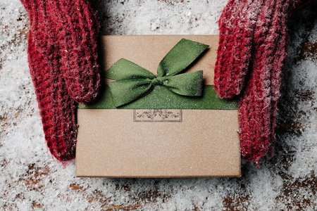 Hands holding Rustic Decorated Christmas Giftの写真素材
