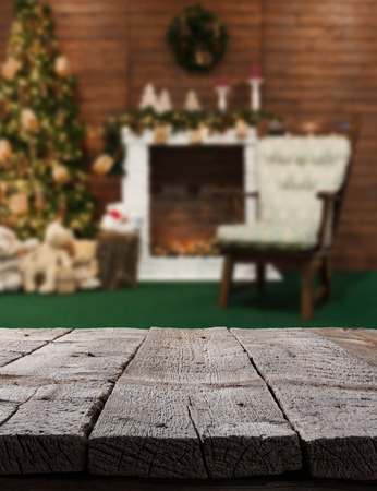 Christmas table background with christmas tree on a backdropの写真素材