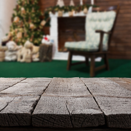 Christmas table background with christmas tree on a backdropの写真素材