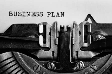 Business plan written by a typewriter on a paper sheet. Space for your textの写真素材