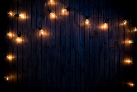 Light bulbs on dark Wooden Backgroundの写真素材