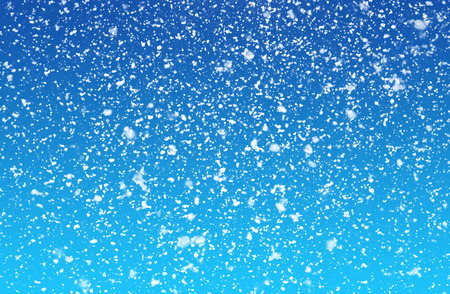 falling snow on the blue backgroundの写真素材