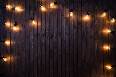 Light bulbs on dark Wooden Background real imageの写真素材