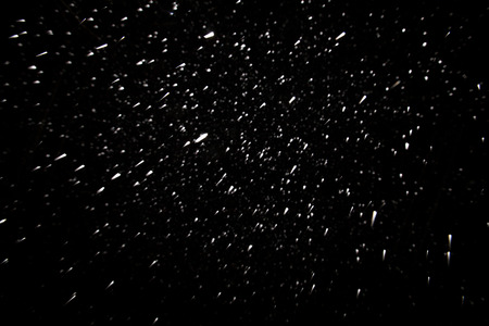 Christmas winter snow background on blackの写真素材