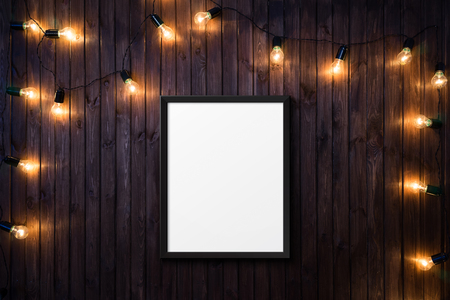 Light bulbs on dark Wooden Background with a posterの写真素材