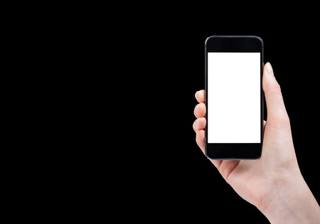 Female hand holding smart phone isolated on white backgroundの写真素材