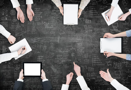 Brainstorming Concept / Aerial View of Business People Planning over business planの写真素材