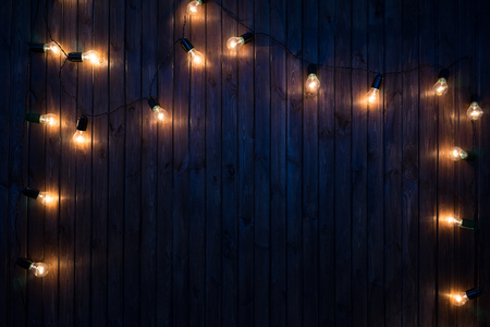 Light bulbs on dark Wooden Backgroundの写真素材