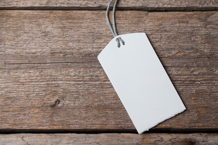 Visit card on wooden table in darkの写真素材