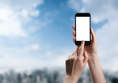 woman hand taking photo of the city with a smartphoneの写真素材