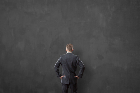 businessman looking at a wallの写真素材