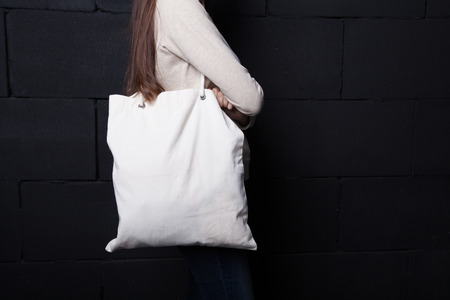 Woman holding clean shopping bag