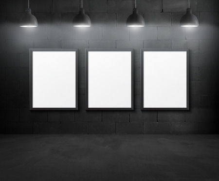 Black brick room interior design with pendant lamps and postersの写真素材