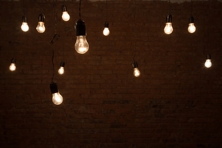 Light bulbs over brick all textureの写真素材