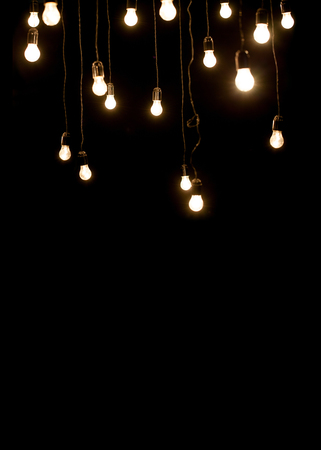 Light bulbs over dark textureの写真素材