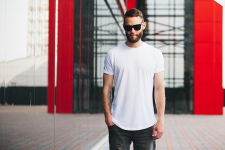 Hipster wearing white blank t-shirt with space for your logoの写真素材