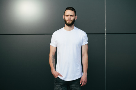Hipster wearing white blank t-shirt with space for your logoの写真素材