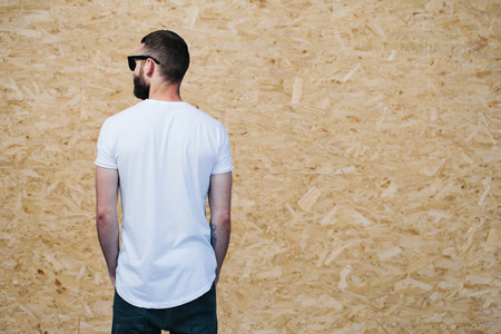 Hipster wearing white blank t-shirt with space for your logoの写真素材