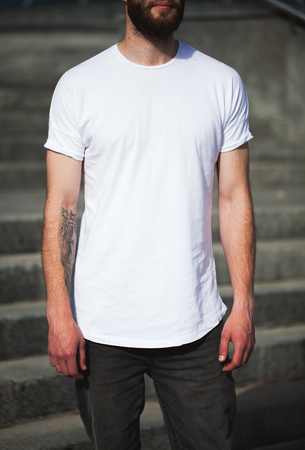 Hipster wearing white blank t-shirt with space for your logoの写真素材