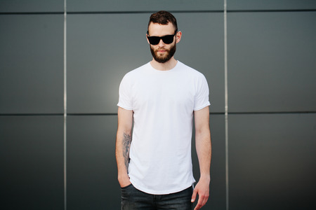 Hipster wearing white blank t-shirt with space for your logoの写真素材