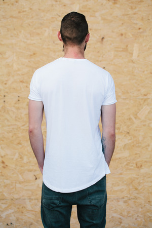 Hipster wearing white blank t-shirt with space for your logoの写真素材
