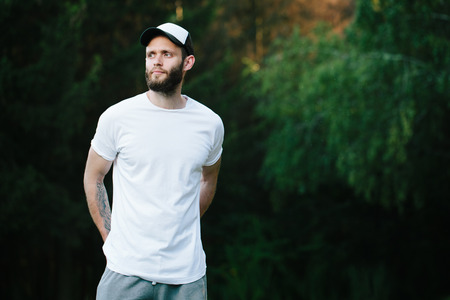 Hipster man wearing white blank t-shirt with space for your logoの写真素材