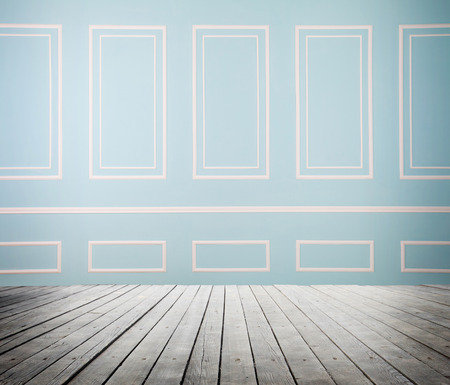 room interior with wooden floor and blue wallの写真素材