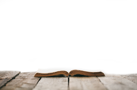 Old bible on a wooden tableの写真素材