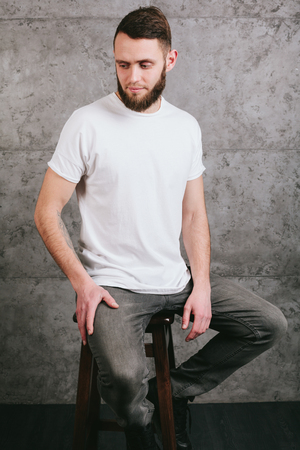 Man wearing white blank t-shirt with space for your logoの写真素材