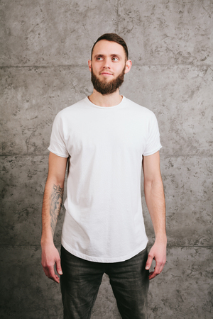 Man wearing white blank t-shirt with space for your logoの写真素材