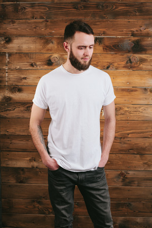 Man wearing white blank t-shirt with space for your logoの写真素材