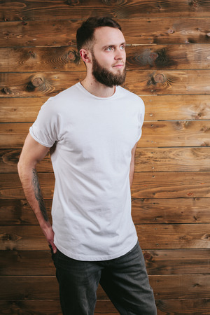 Man wearing white blank t-shirt with space for your logoの写真素材