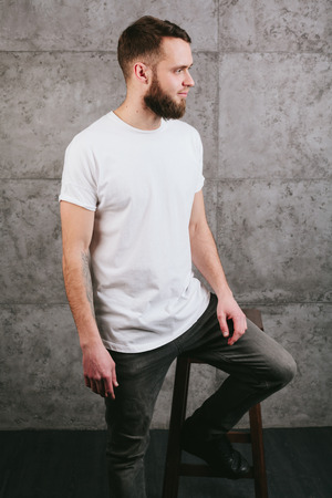 Man wearing white blank t-shirt with space for your logoの写真素材