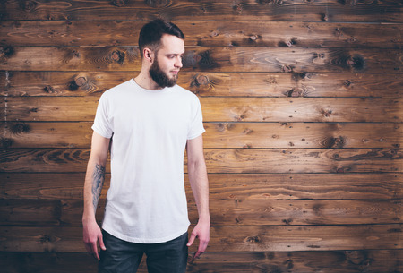 Man wearing white blank t-shirt with space for your logoの写真素材