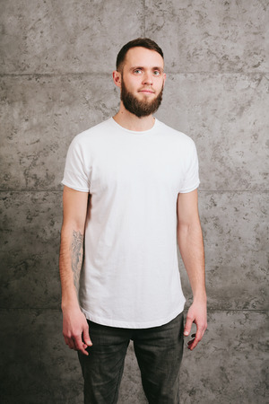 Man wearing white blank t-shirt with space for your logoの写真素材