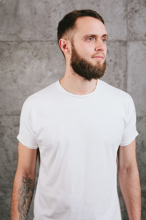 Man wearing white blank t-shirt with space for your logoの写真素材