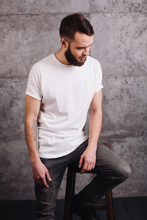 Man wearing white blank t-shirt with space for your logoの写真素材