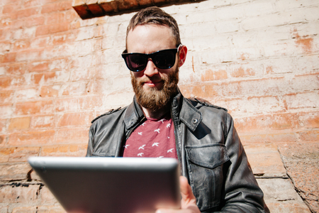 Hipster man with beard wearing glassesの写真素材