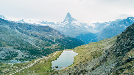 Matterhorn Mountain with white snow and blue sky in Zermatt city in Switzerlandの写真素材