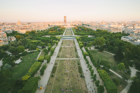 Paris, France - June 19, 2017: View of city of Paris from Eiffel tower where people are relaxing on the grassのeditorial素材