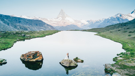 Wedding couple getting married in the mountains in Switzerlandの写真素材