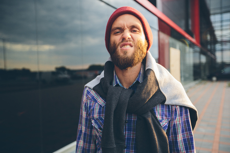 Sexy hipster man with beard posing wearing trendy clothesの写真素材