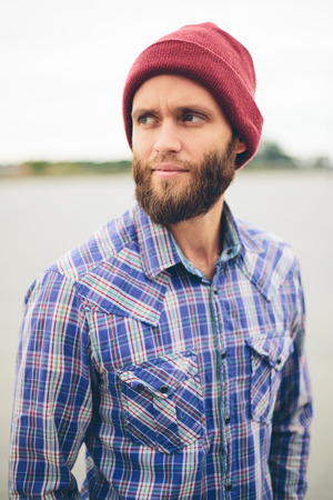 Sexy hipster man with beard posing wearing trendy clothesの写真素材