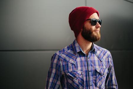 Sexy hipster man with beard posing wearing trendy clothesの写真素材
