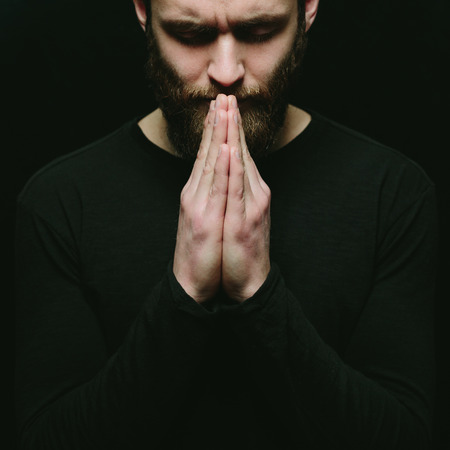 Prayer of a man in a darkの写真素材