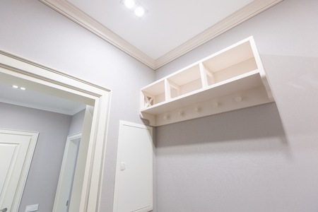 White shelf in a closet room interiorの写真素材