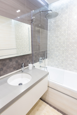 Modern bathroom with shower and a sinkの写真素材