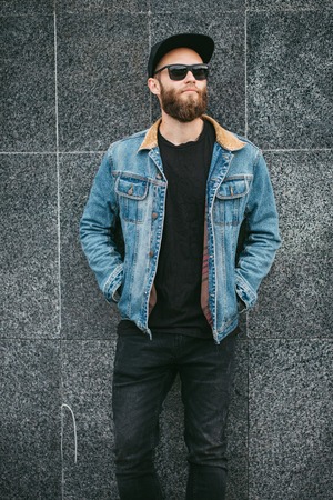 Hipster handsome male model with beard wearing black blank t-shirt
