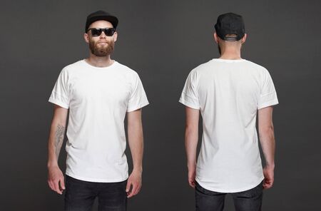 Hipster handsome male model with beard wearing white blank t-shirt and a baseball cap with space for your logo or design in casual urban style. Front and back viewの写真素材