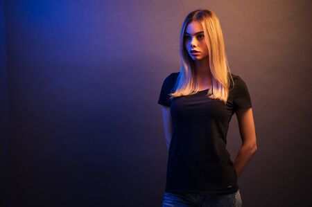 Fashion headshot of a sexy blonde woman with a make up wearing black clothesの写真素材